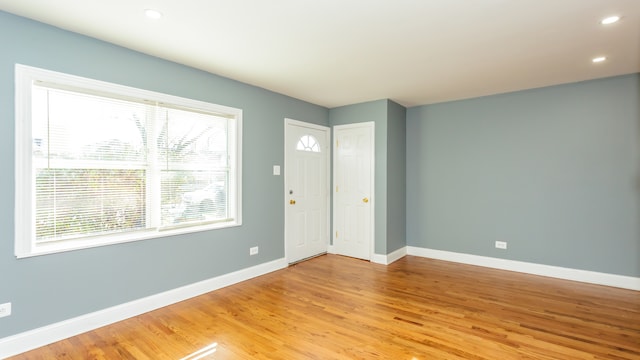 unfurnished room featuring light hardwood / wood-style floors