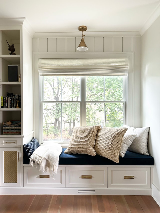 mudroom with hardwood / wood-style floors and crown molding