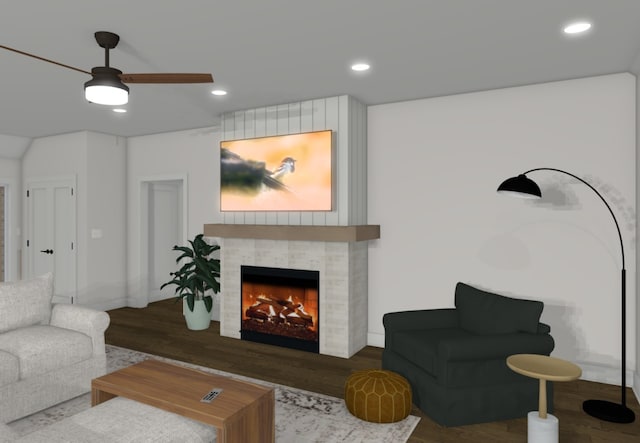 living room with ceiling fan, dark hardwood / wood-style floors, and a fireplace