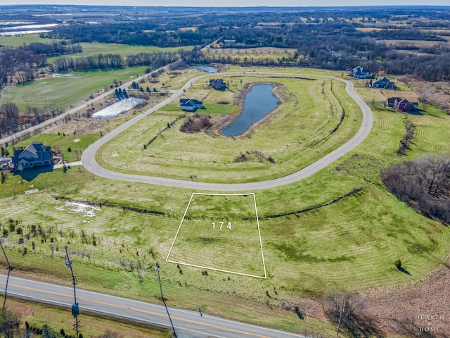 drone / aerial view with a rural view and a water view