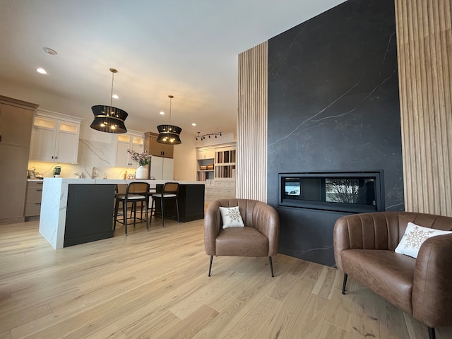 sitting room with light hardwood / wood-style floors