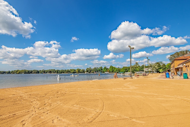 surrounding community with a water view