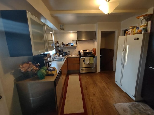 kitchen with sink, stainless steel appliances, dark hardwood / wood-style floors, and wall chimney range hood