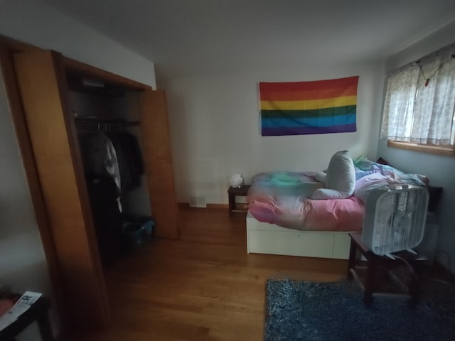 bedroom featuring hardwood / wood-style floors