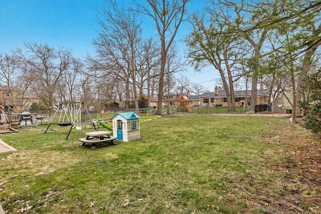 view of yard with a playground and fence