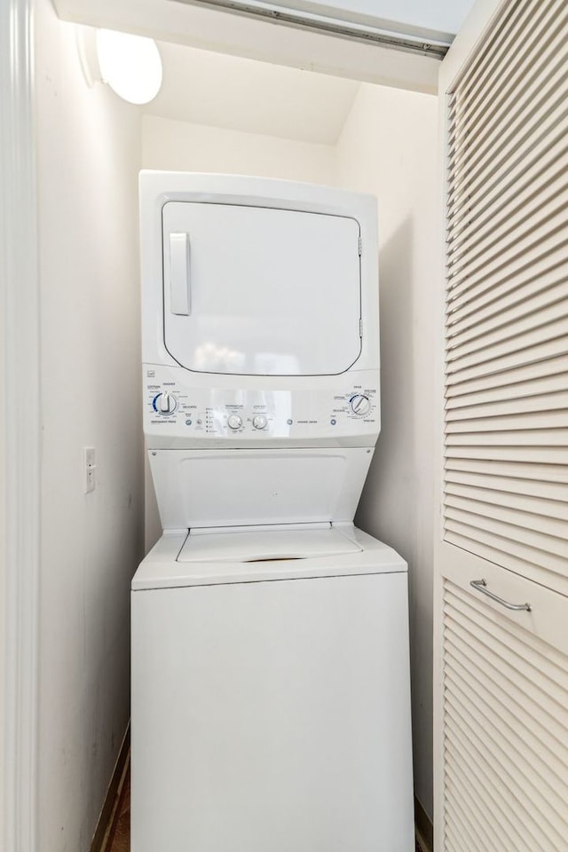 laundry room featuring stacked washing maching and dryer