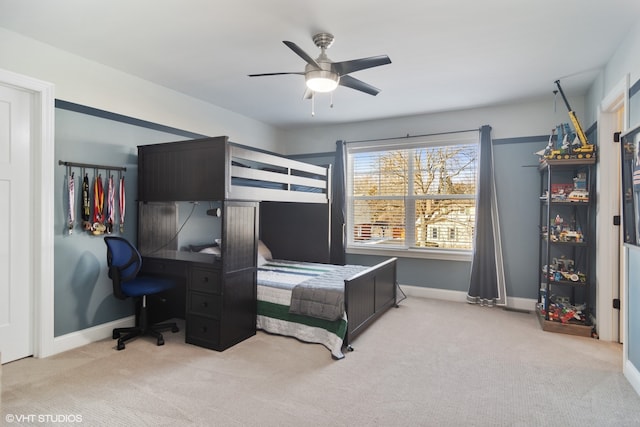 bedroom featuring light colored carpet and ceiling fan