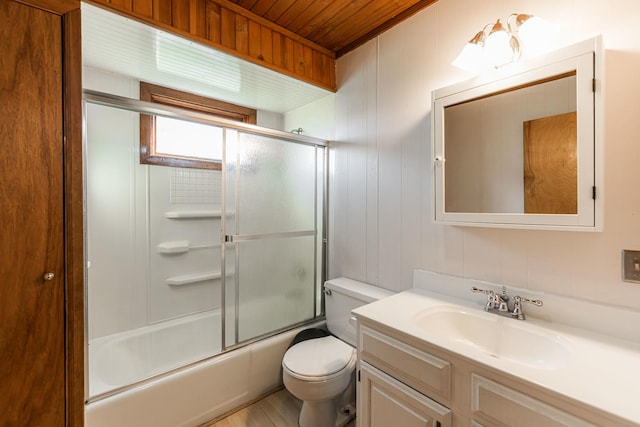 full bathroom featuring wooden ceiling, shower / bath combination with glass door, vanity, and toilet