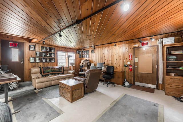 living room with wooden ceiling, rail lighting, finished concrete floors, and wood walls