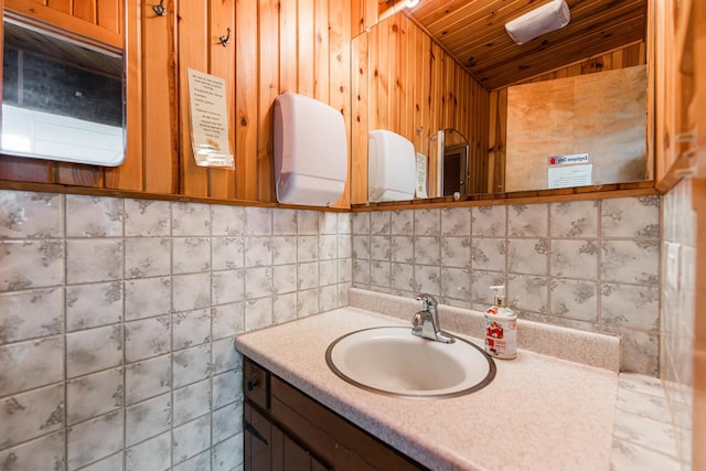 bathroom with wood ceiling, vaulted ceiling, and vanity