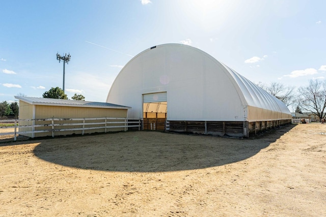 view of pole building with an exterior structure