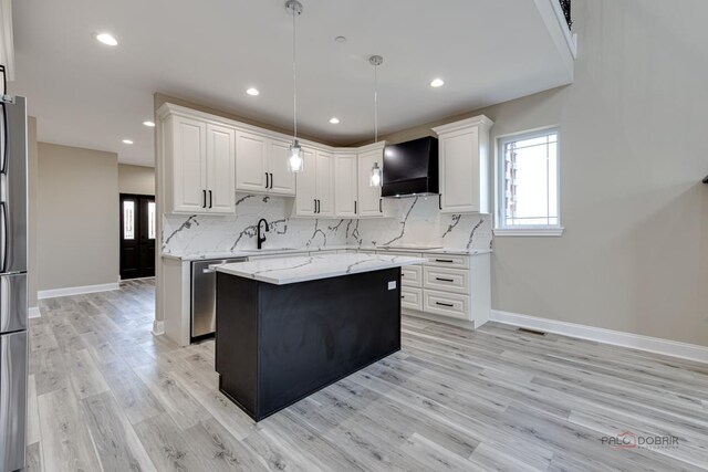 180 N E River Rd Unit E, Des Plaines, IL 60016 - kitchen featuring decorative backsplash, white cabinets, light wood finished floors, a kitchen island, and appliances with stainless steel finishes