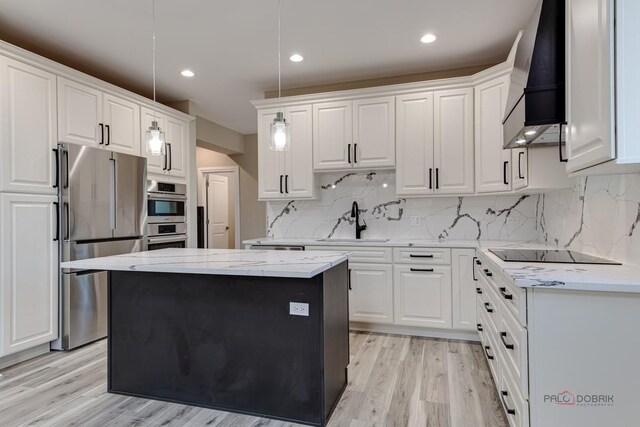 180 N E River Rd Unit E, Des Plaines, IL 60016 - kitchen with premium range hood, a sink, white cabinetry, and appliances with stainless steel finishes