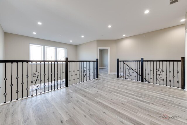 180 N E River Rd Unit E, Des Plaines, IL 60016 - empty room with recessed lighting, visible vents, and wood finished floors