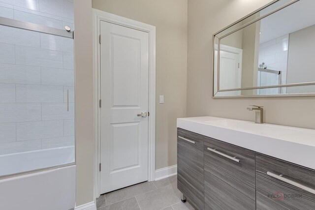 180 N E River Rd Unit E, Des Plaines, IL 60016 - full bathroom featuring tile patterned floors, tub / shower combination, baseboards, and vanity