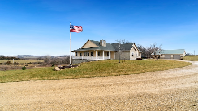 farmhouse inspired home with covered porch and a front yard