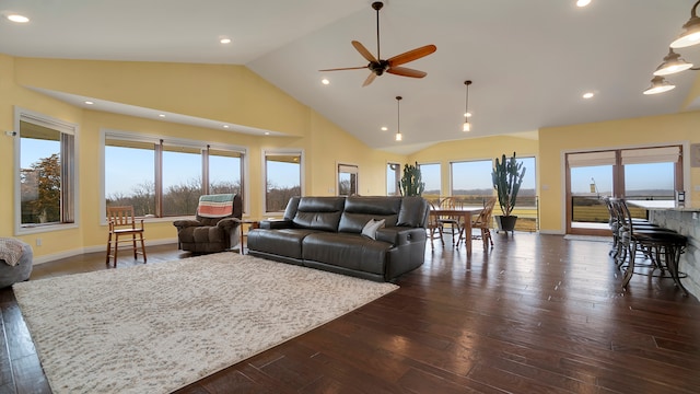 living room with high vaulted ceiling, ceiling fan, and dark hardwood / wood-style flooring