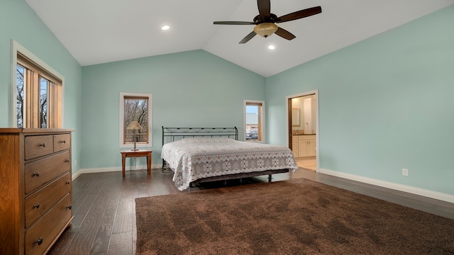 bedroom with lofted ceiling, multiple windows, ceiling fan, dark hardwood / wood-style flooring, and ensuite bathroom