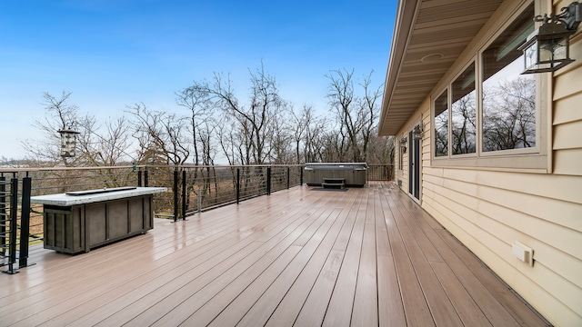 deck with a hot tub