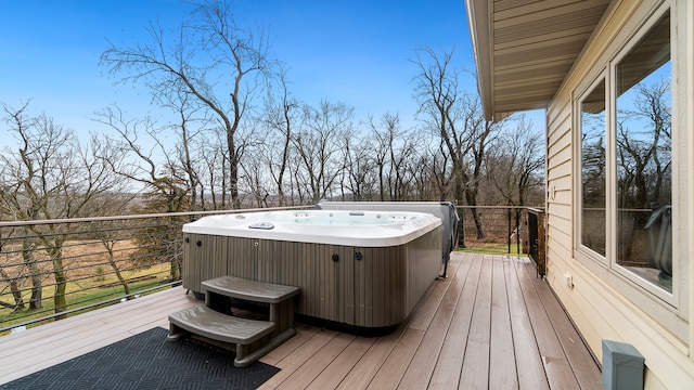 wooden terrace featuring a hot tub