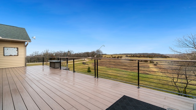 wooden deck featuring a rural view