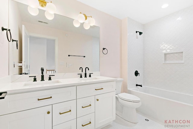 full bathroom with tiled shower / bath, toilet, tile flooring, and double sink vanity