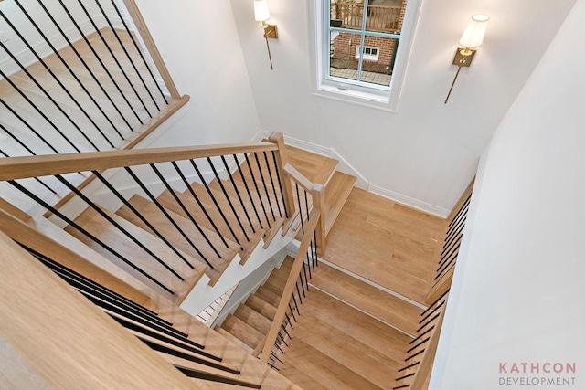 stairway featuring light wood-type flooring