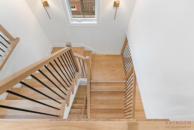 stairs featuring light hardwood / wood-style flooring