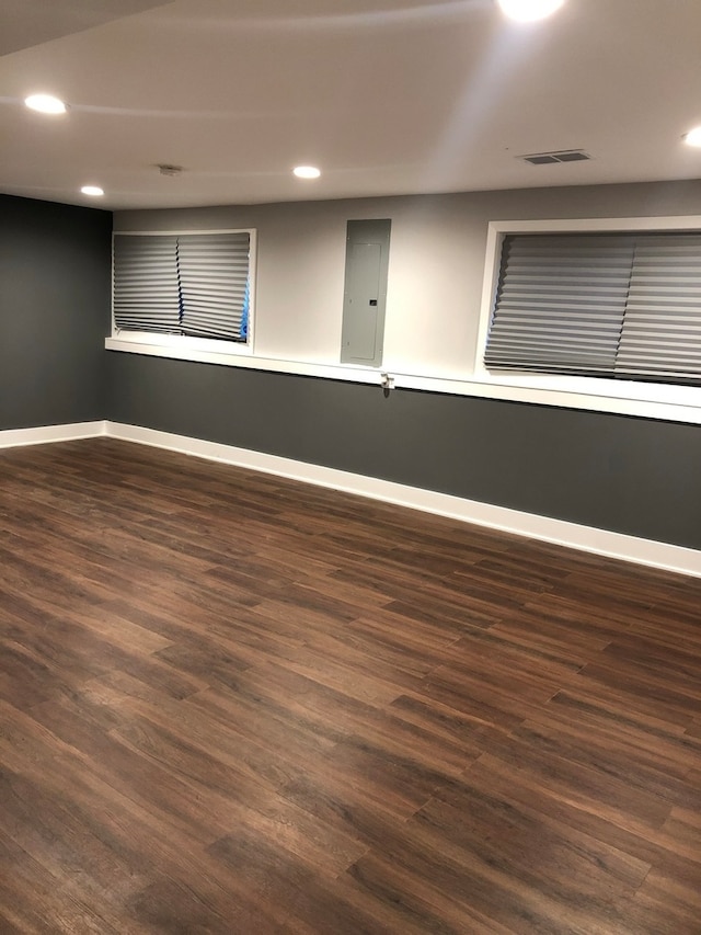 empty room with dark hardwood / wood-style floors