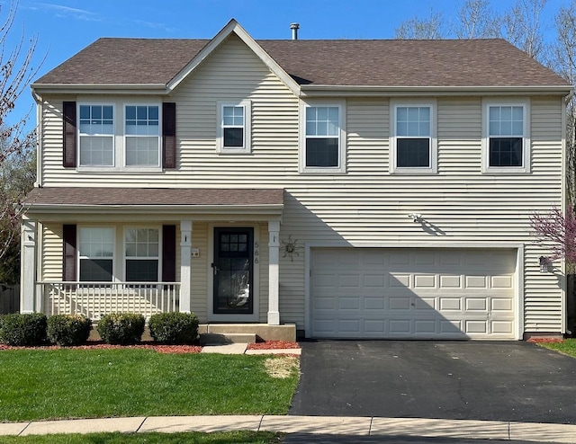 traditional-style home featuring a porch, a garage, aphalt driveway, a shingled roof, and a front lawn