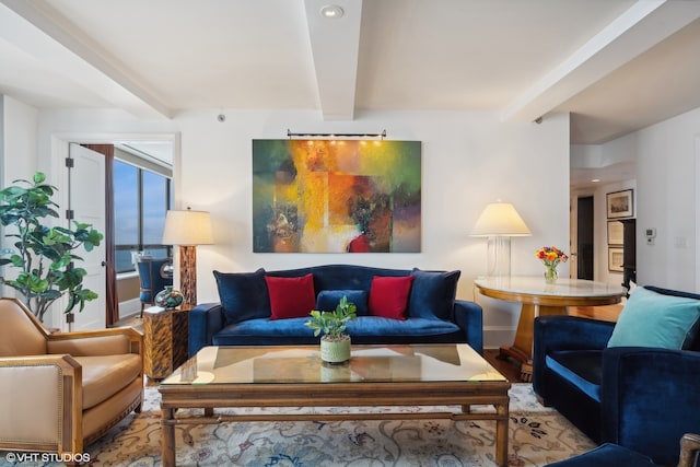 living room featuring light wood-type flooring and beamed ceiling