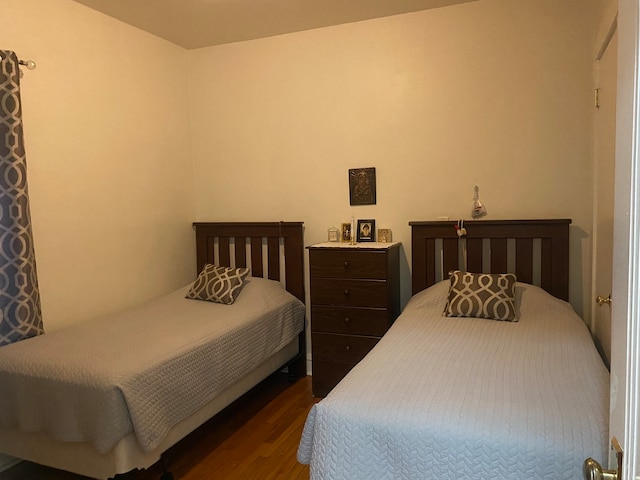 bedroom featuring dark hardwood / wood-style floors