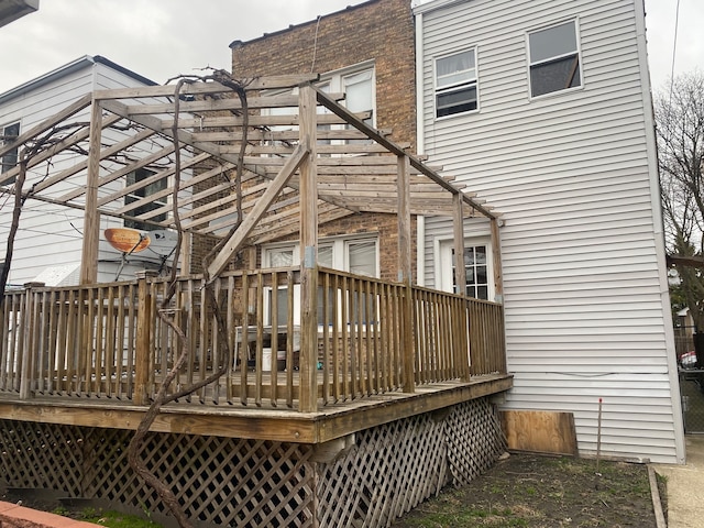 back of property featuring a deck