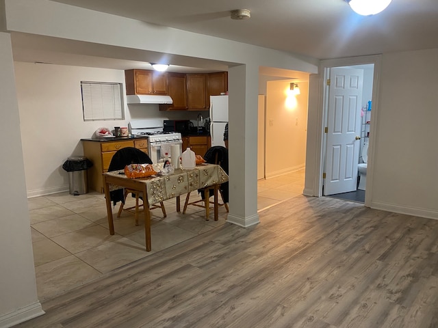 interior space featuring white appliances and light wood-type flooring