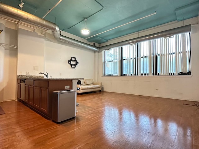 basement with hardwood / wood-style floors