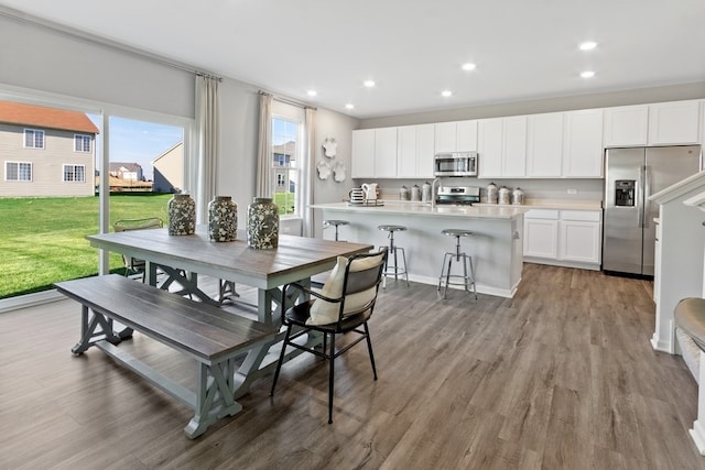 dining area with light hardwood / wood-style floors