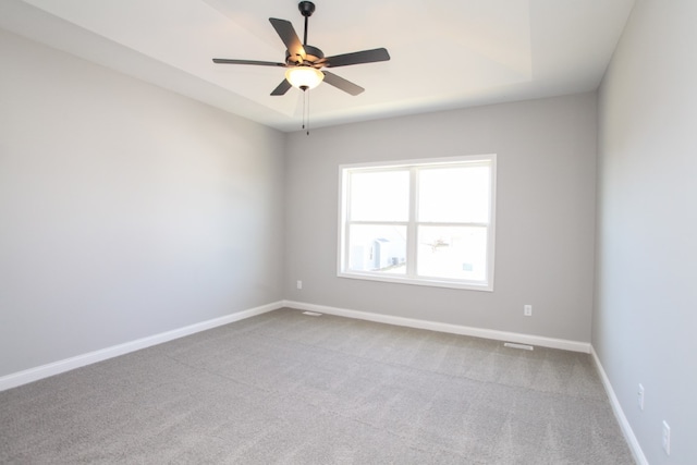 empty room featuring light carpet and ceiling fan