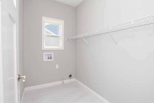 laundry area featuring hookup for a gas dryer, washer hookup, and light tile floors