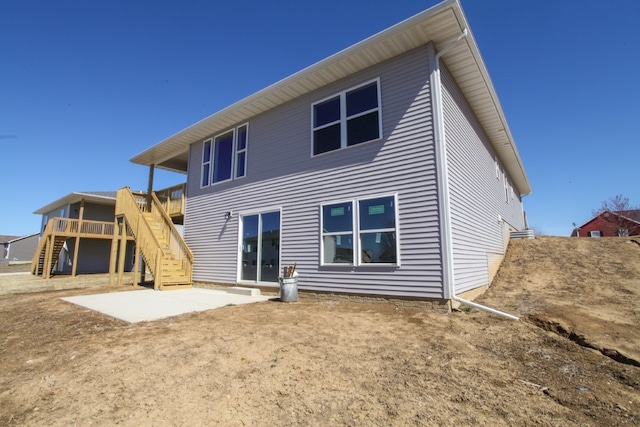 rear view of property featuring a patio