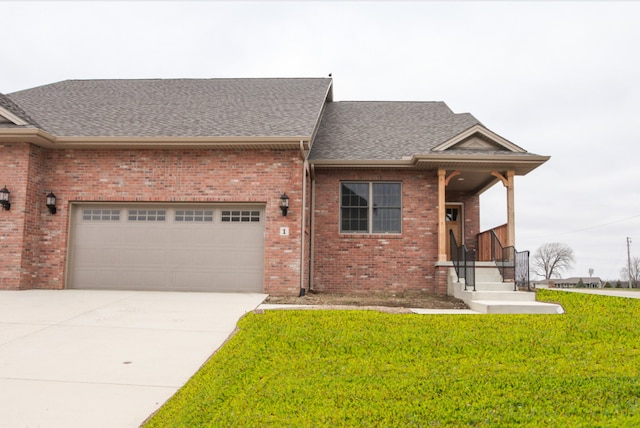 view of front facade with a front lawn and a garage