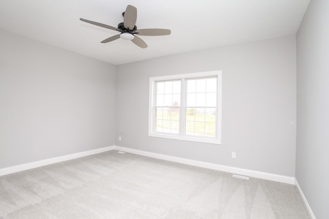 empty room with light carpet and ceiling fan