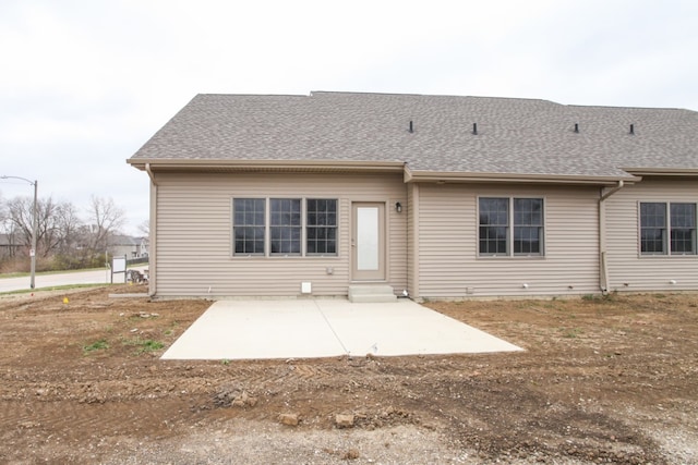 rear view of property featuring a patio area