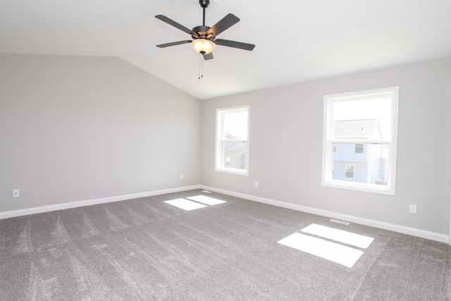 unfurnished room with ceiling fan, carpet flooring, and lofted ceiling