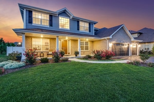 view of front of home with a garage and a yard