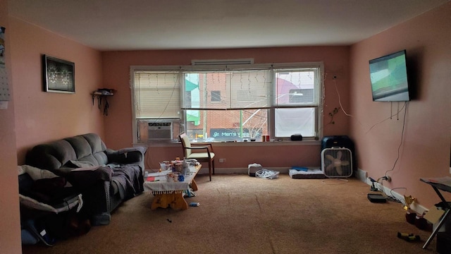 living area featuring carpet and a healthy amount of sunlight