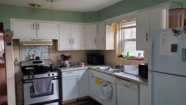 kitchen with white cabinets, backsplash, white appliances, and range hood