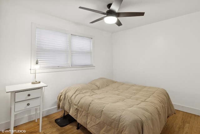 bedroom featuring ceiling fan and light hardwood / wood-style flooring