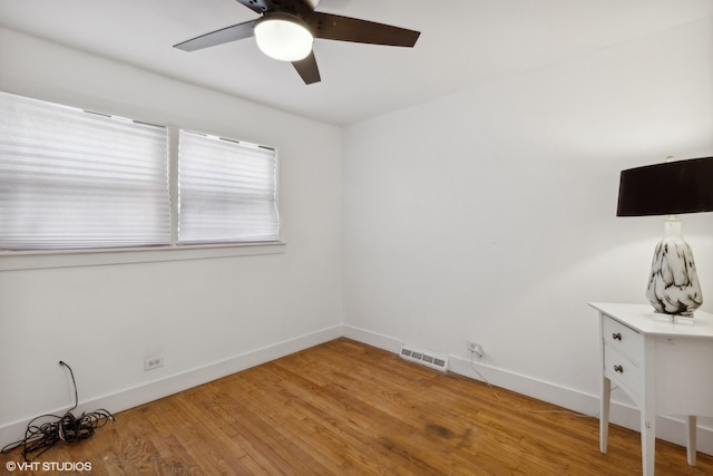 unfurnished room with ceiling fan and light hardwood / wood-style flooring