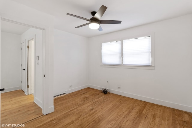 unfurnished room featuring ceiling fan and light wood-type flooring