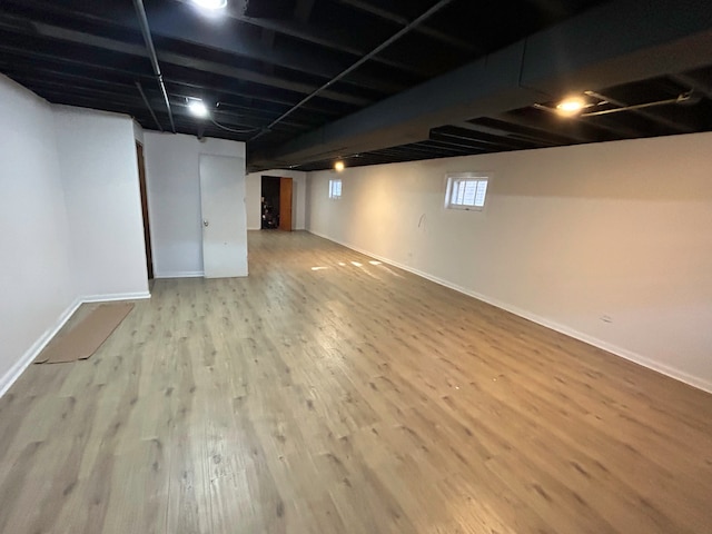 basement with light wood-type flooring